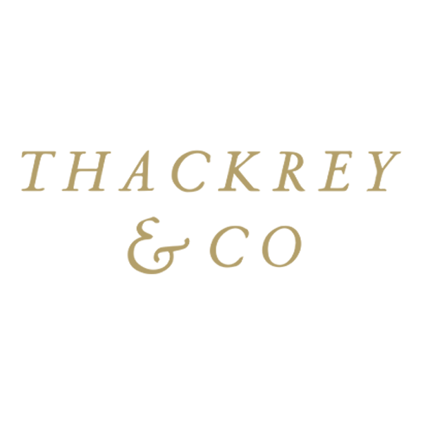 Thackrey gold logo